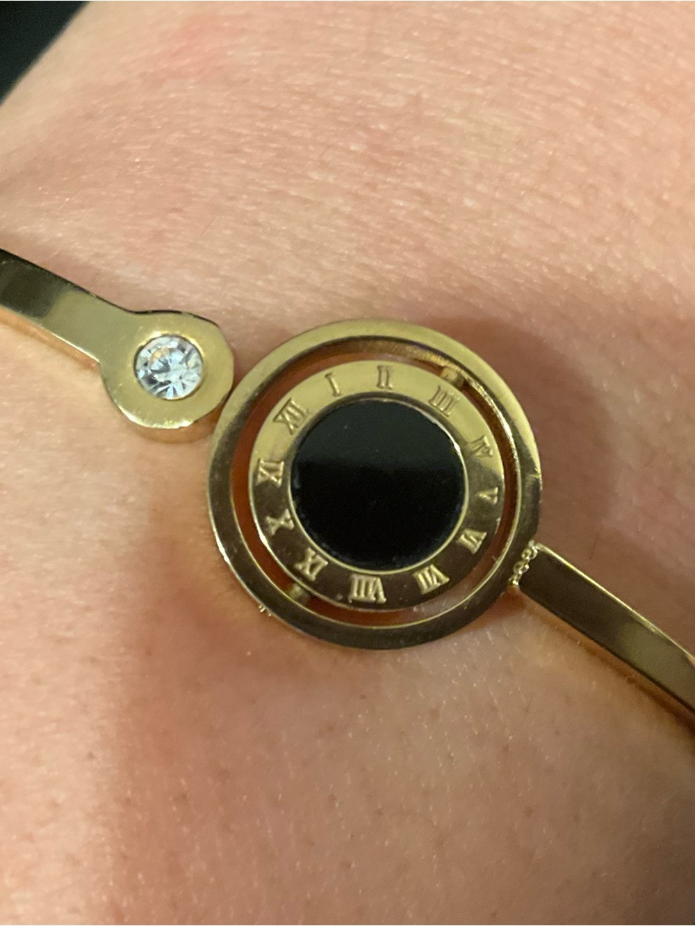 Gold-tone Bracelet with rotating Black & white Center
